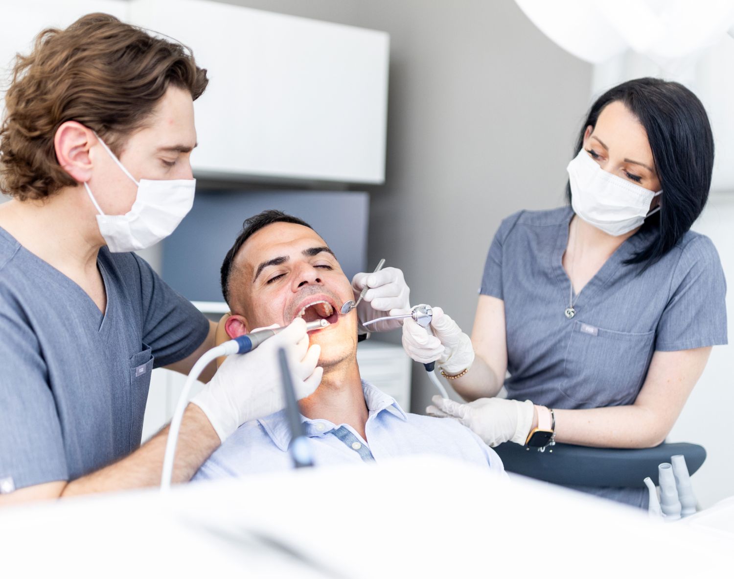 millburn dentist providing treatment to a patient